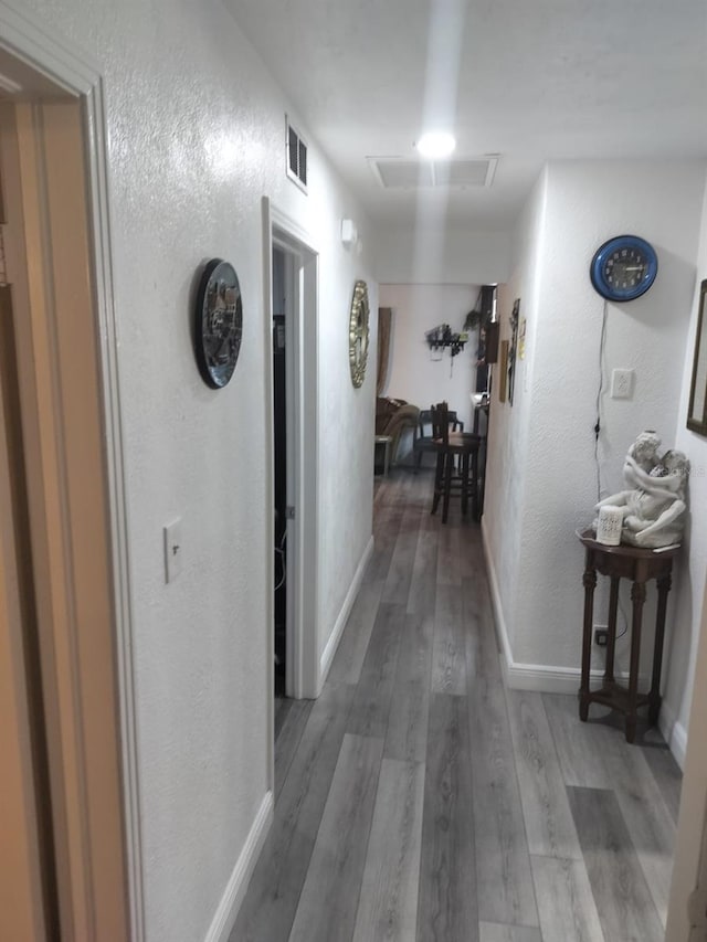 corridor featuring dark hardwood / wood-style floors