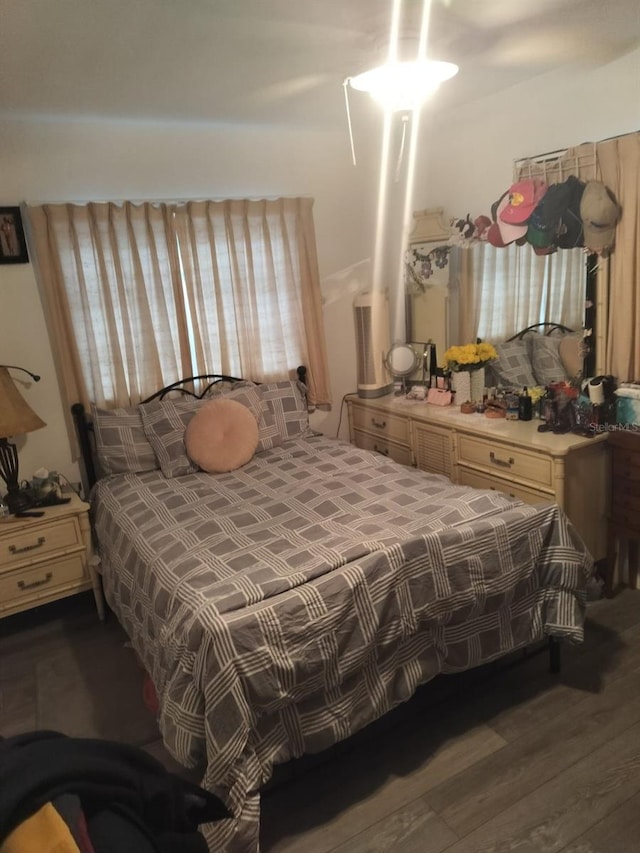 bedroom featuring dark wood-type flooring