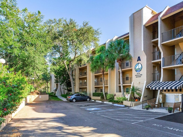 view of property with uncovered parking