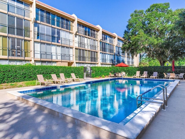 view of swimming pool featuring a patio area