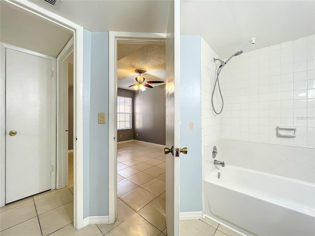 bathroom featuring a textured ceiling, ceiling fan, and tile flooring