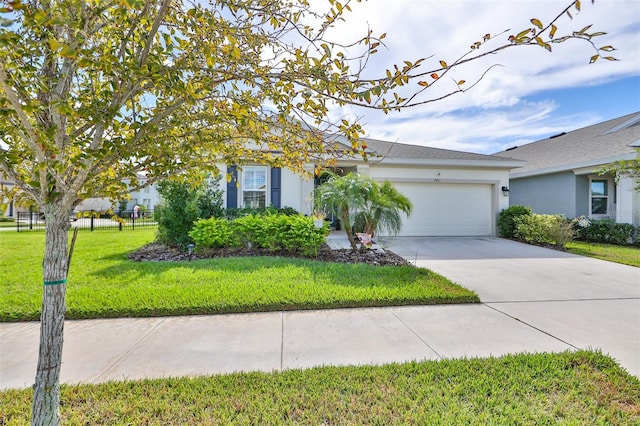 view of front of property with concrete driveway, a front yard, an attached garage, and stucco siding