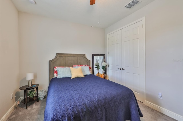 carpeted bedroom with a closet and ceiling fan