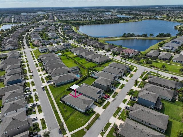 birds eye view of property with a water view