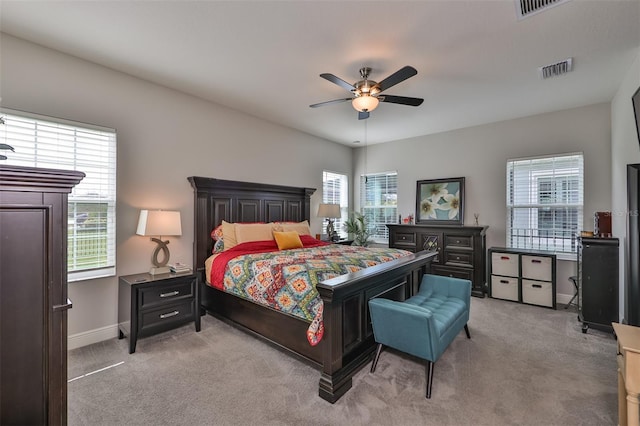 bedroom with light carpet and ceiling fan