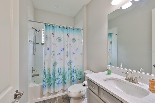 full bathroom with vanity, toilet, wood-type flooring, and shower / tub combo