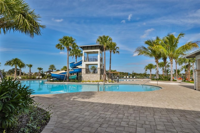 view of pool with a water slide