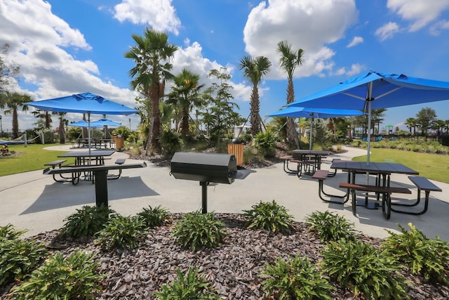 view of home's community with a patio area and a yard