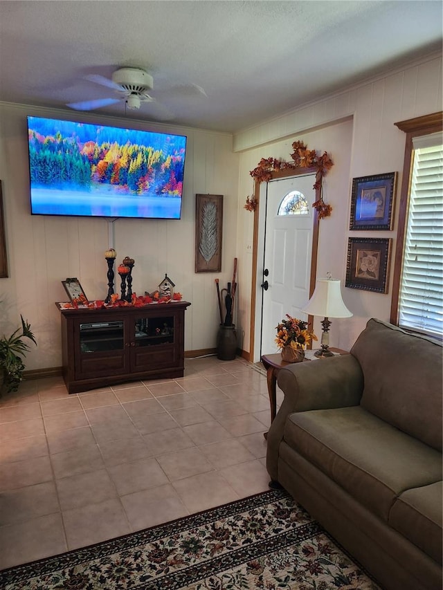 living room with light tile flooring and ceiling fan