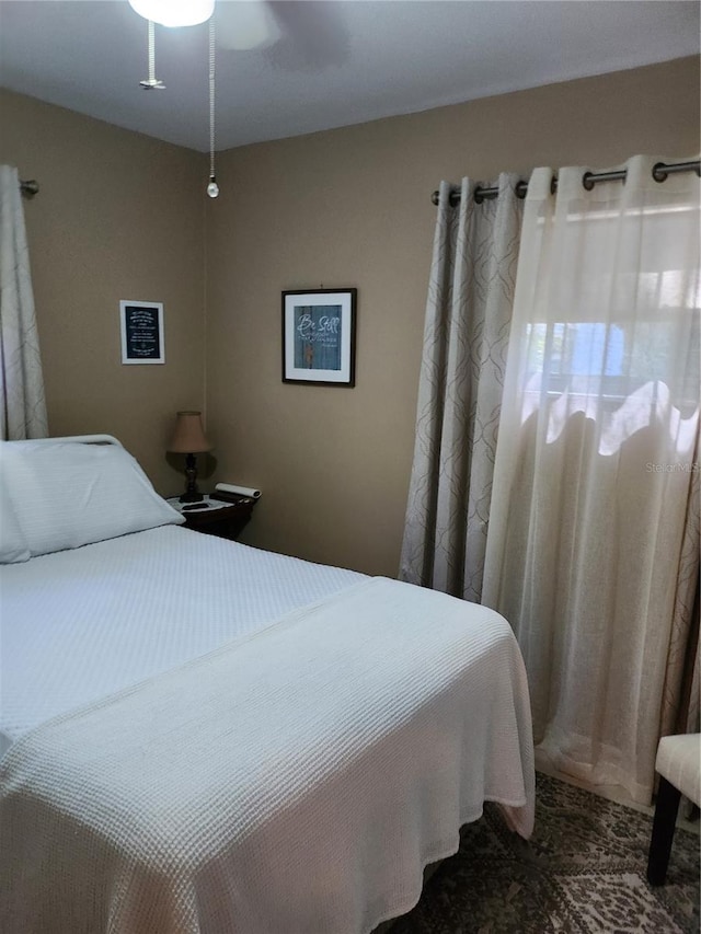 bedroom featuring ceiling fan