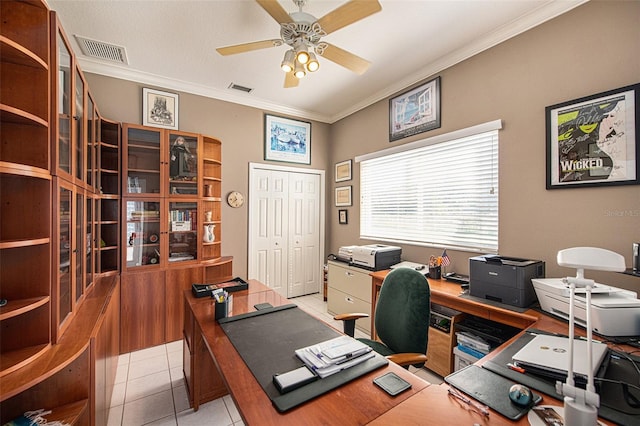 tiled home office with ceiling fan and ornamental molding