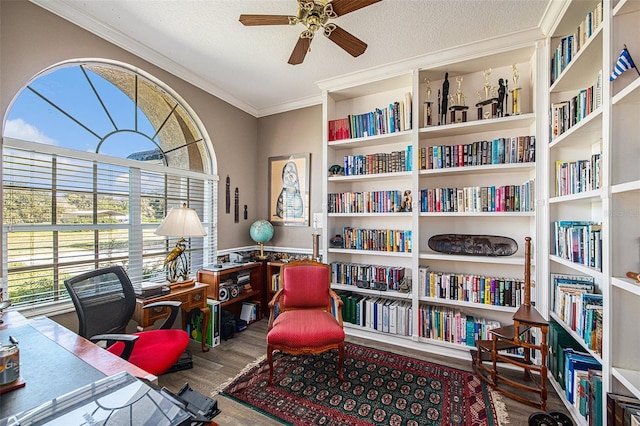 office space with ceiling fan, crown molding, wood-type flooring, and a textured ceiling