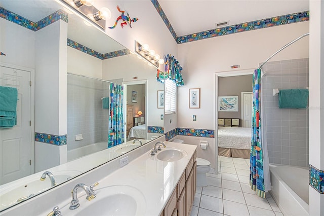 full bathroom featuring toilet, shower / bath combination with curtain, vanity, and tile patterned floors