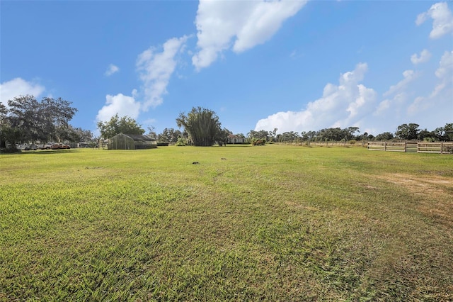 view of yard with a rural view