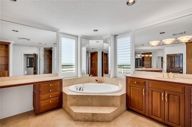 bathroom with tile patterned flooring, a healthy amount of sunlight, tiled tub, and ornamental molding