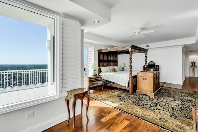 bedroom featuring access to exterior, wood-type flooring, and ceiling fan