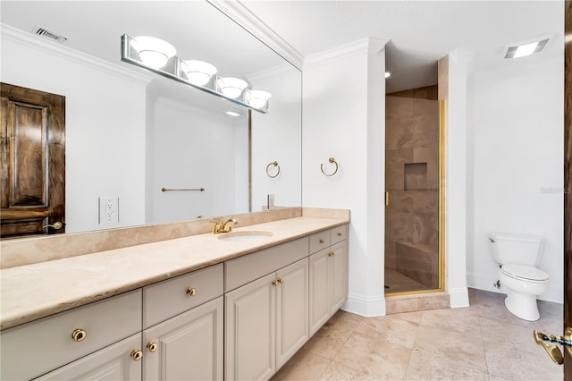 bathroom with toilet, vanity, a shower with door, and crown molding