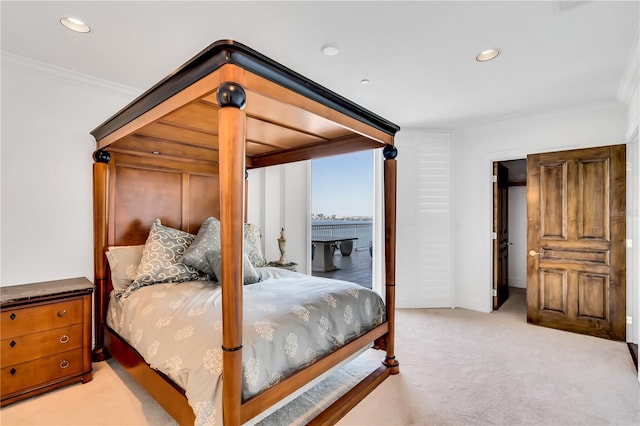 bedroom featuring light colored carpet and crown molding