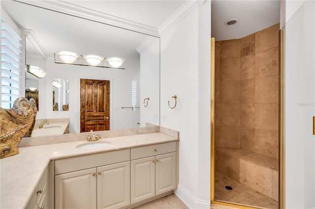 bathroom with vanity, a tile shower, and crown molding