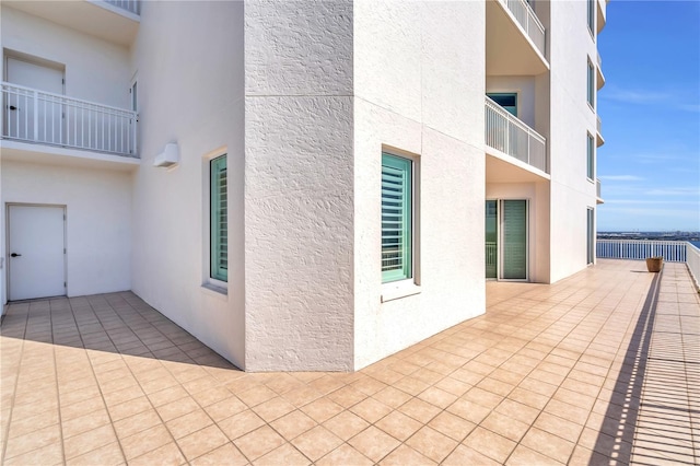 view of side of property featuring a balcony