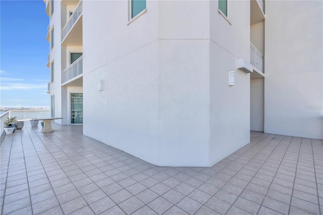 view of property exterior featuring a balcony