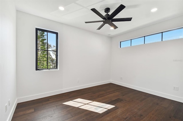 unfurnished room featuring dark wood-type flooring and ceiling fan