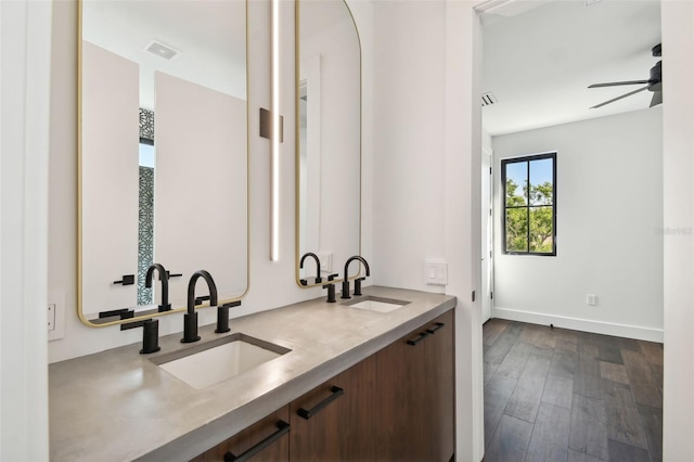 bathroom featuring vanity, hardwood / wood-style floors, and ceiling fan