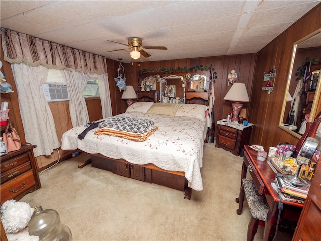 bedroom with light carpet, wooden walls, and ceiling fan