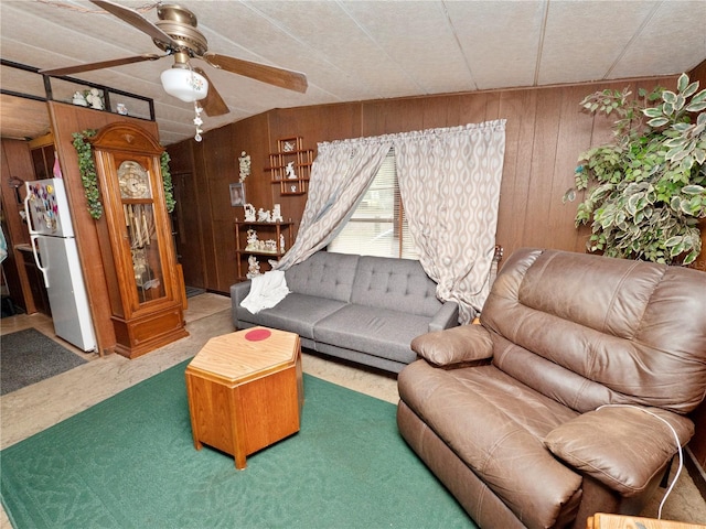 living room with wooden walls and ceiling fan