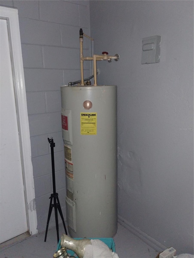 utility room with electric water heater