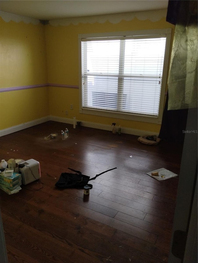 spare room with dark wood-type flooring