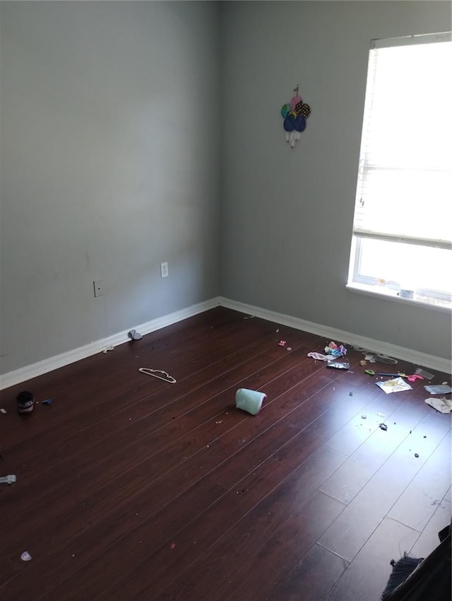 empty room with hardwood / wood-style floors