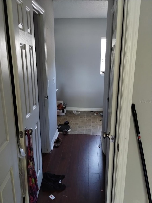 hallway with tile flooring