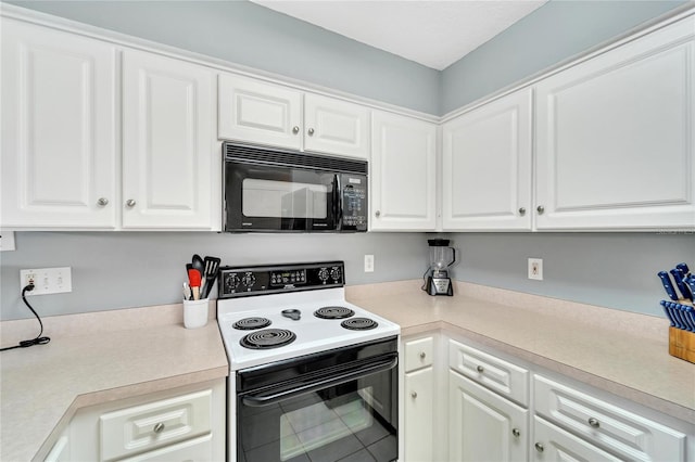 kitchen with white cabinets, tile patterned flooring, and range with electric stovetop