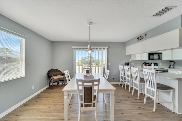 dining room featuring light hardwood / wood-style floors