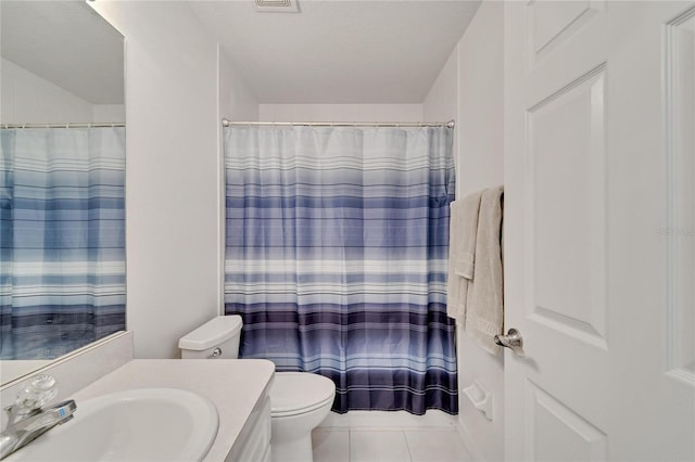 bathroom with vanity, toilet, tile patterned floors, a textured ceiling, and a shower with curtain