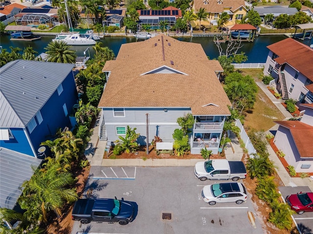 birds eye view of property with a water view