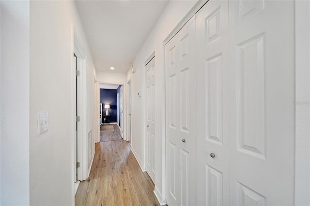 hallway featuring light wood-type flooring