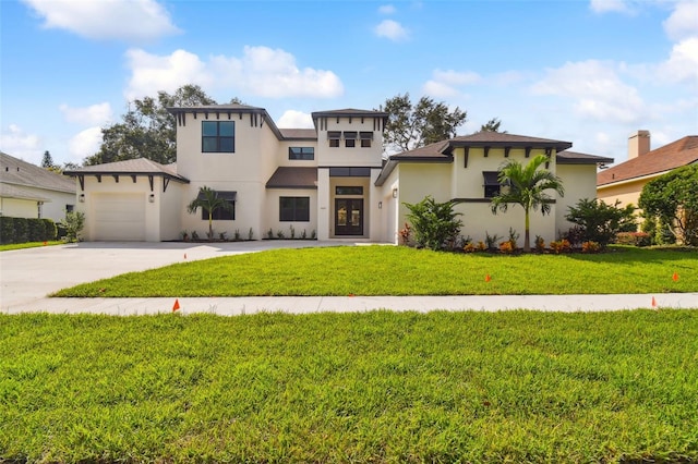 view of front of house featuring a front lawn and a garage