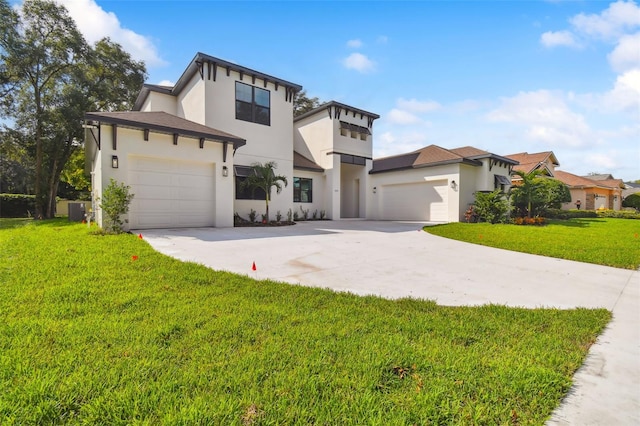 view of front of house with a garage, cooling unit, and a front yard