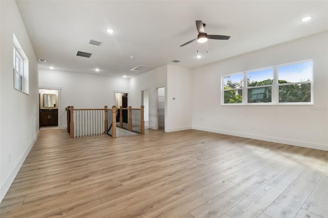 unfurnished room featuring light hardwood / wood-style flooring and ceiling fan