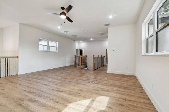 unfurnished room featuring ceiling fan and light hardwood / wood-style flooring