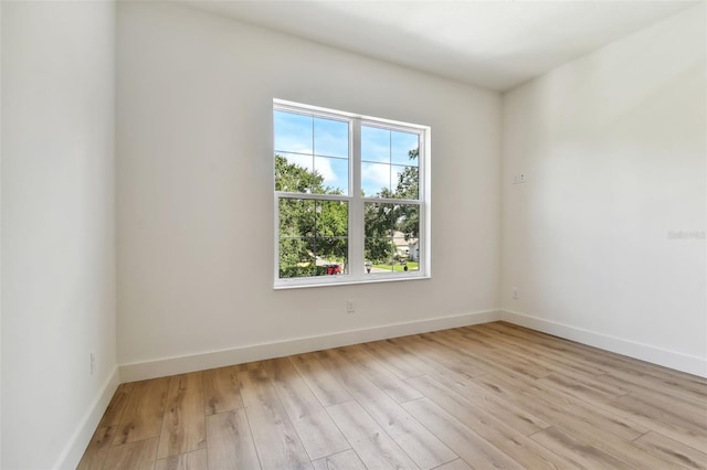 unfurnished room featuring light hardwood / wood-style flooring