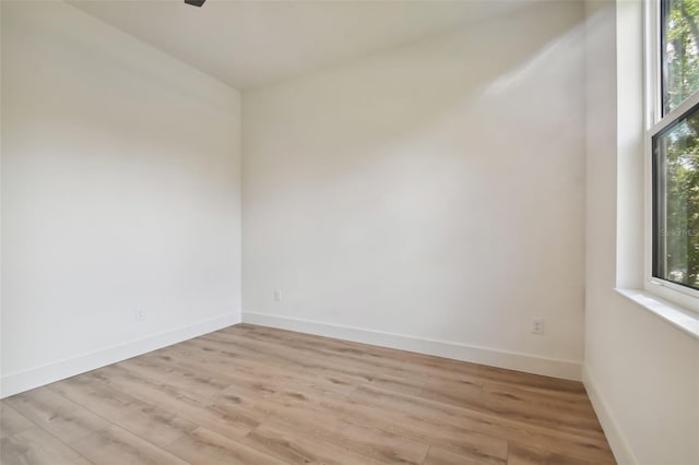 unfurnished room with light hardwood / wood-style floors