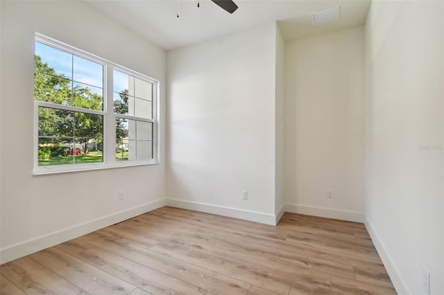 spare room featuring light hardwood / wood-style floors and ceiling fan