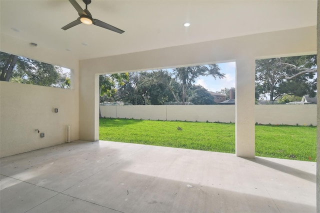 view of patio featuring ceiling fan