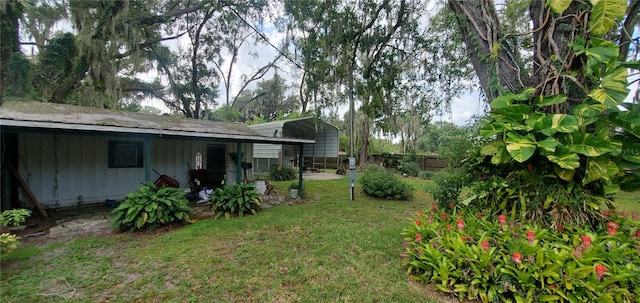 view of yard with a carport