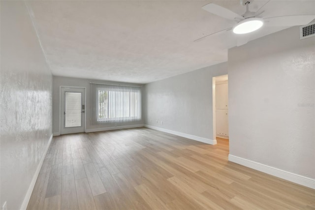 unfurnished room featuring ceiling fan and light wood-type flooring