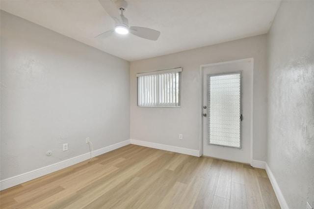 empty room featuring ceiling fan and light wood-type flooring