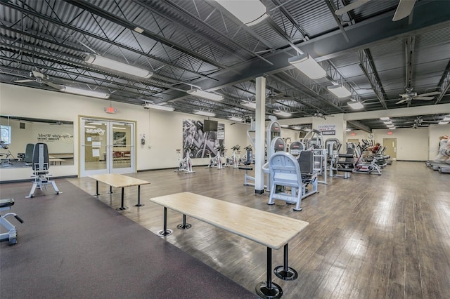 workout area featuring french doors, dark hardwood / wood-style floors, and ceiling fan